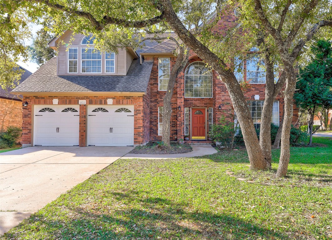 front view of a house with a yard