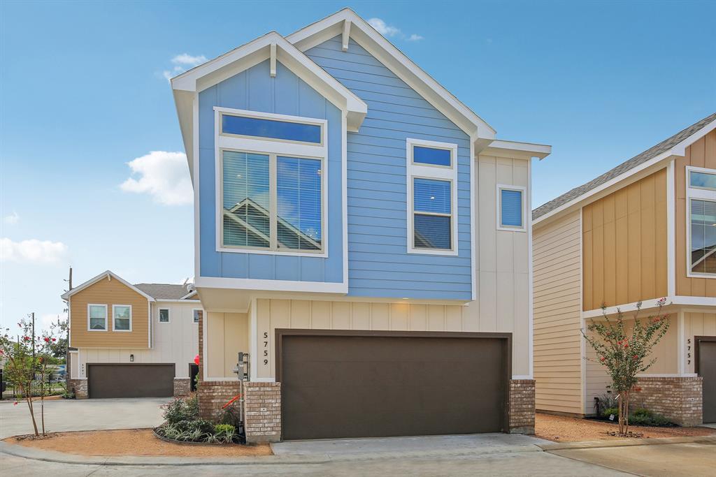 a front view of a house with garage