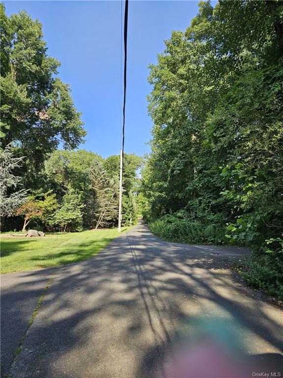 a view of a road with a yard