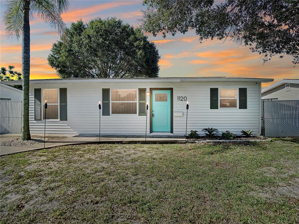 front view of a house with a yard