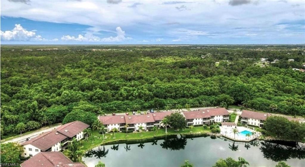 an aerial view of a houses with a lake view