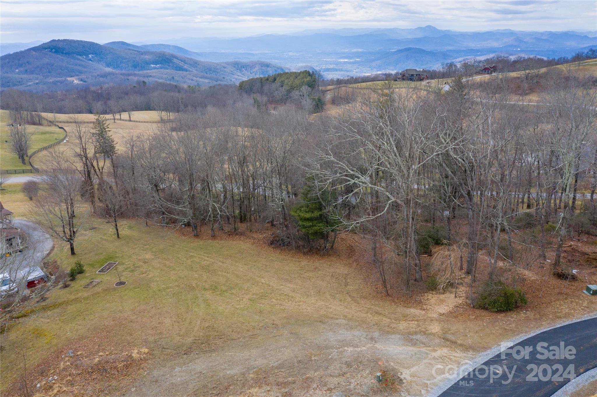 a view of a dry yard with mountain