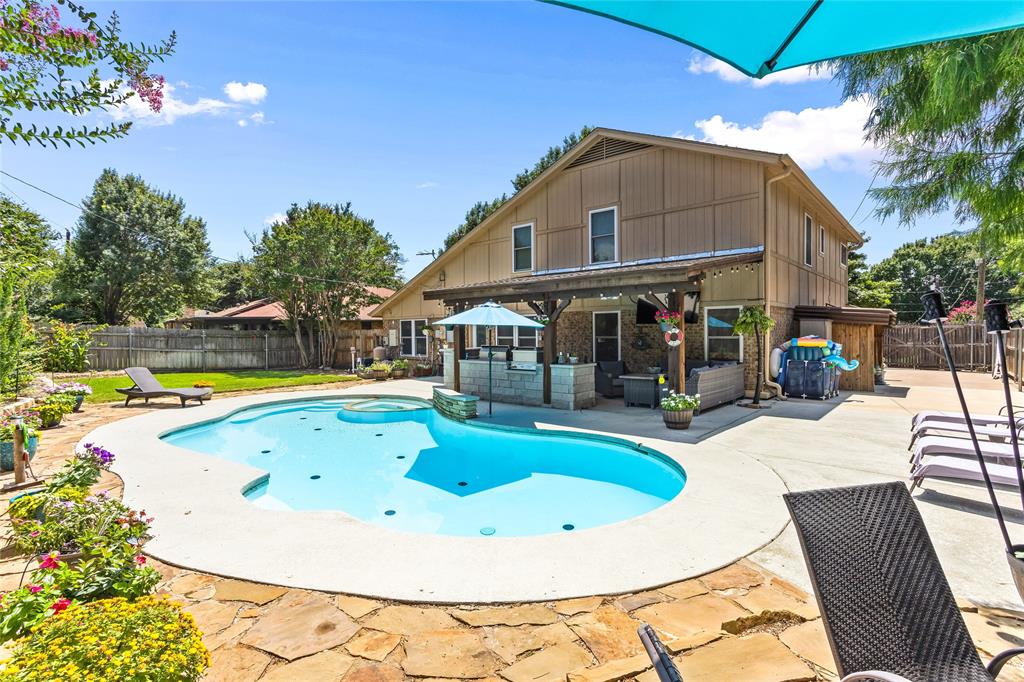 a view of a swimming pool with a patio