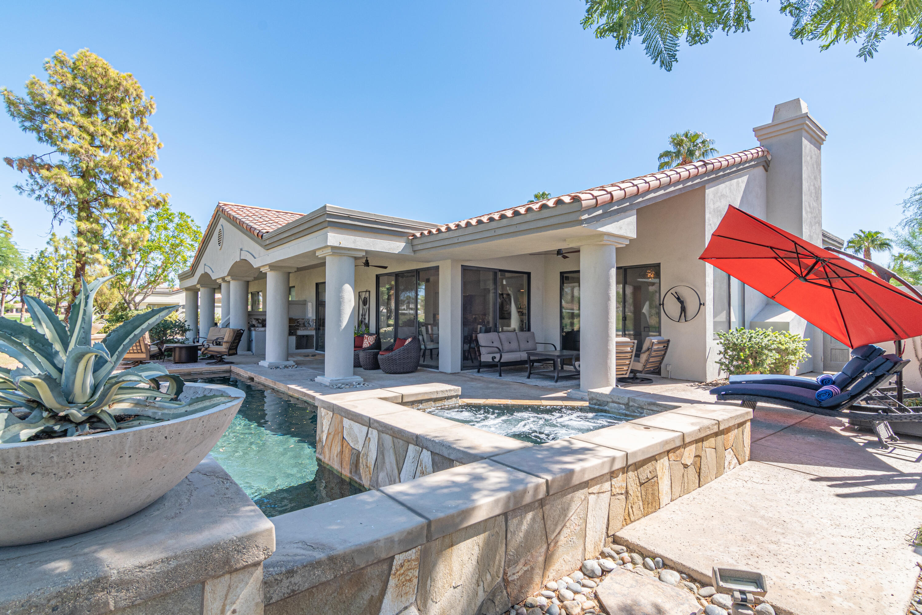 a view of house with outdoor seating