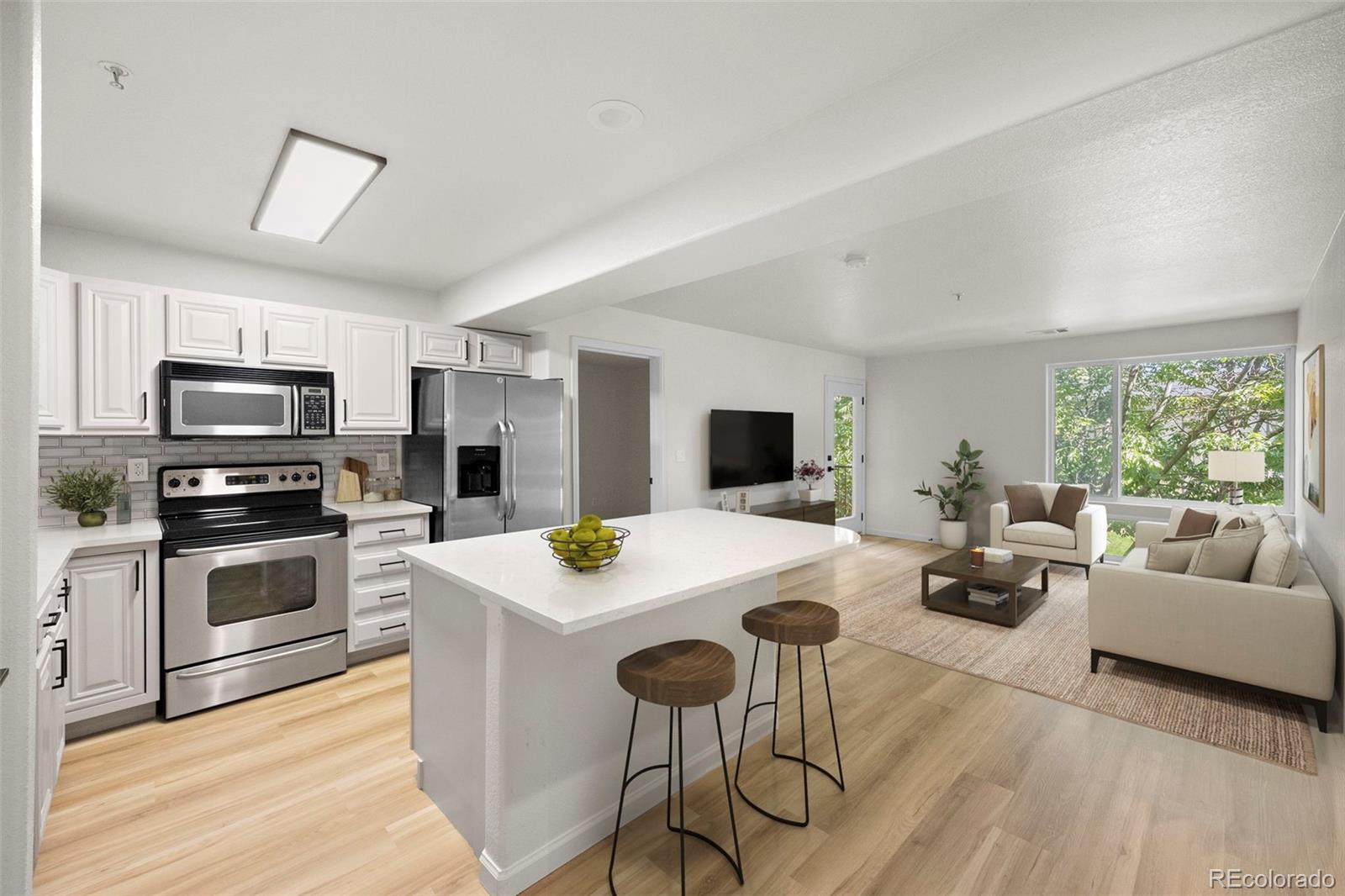 a kitchen with a stove a sink and a refrigerator