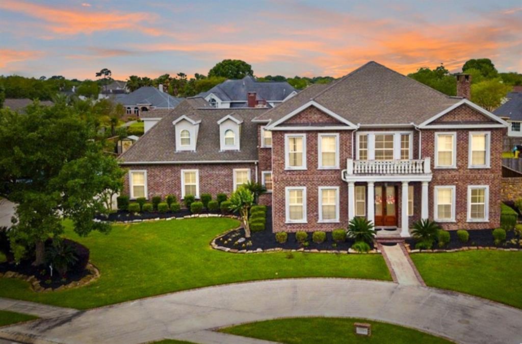 front view of a house next to a yard