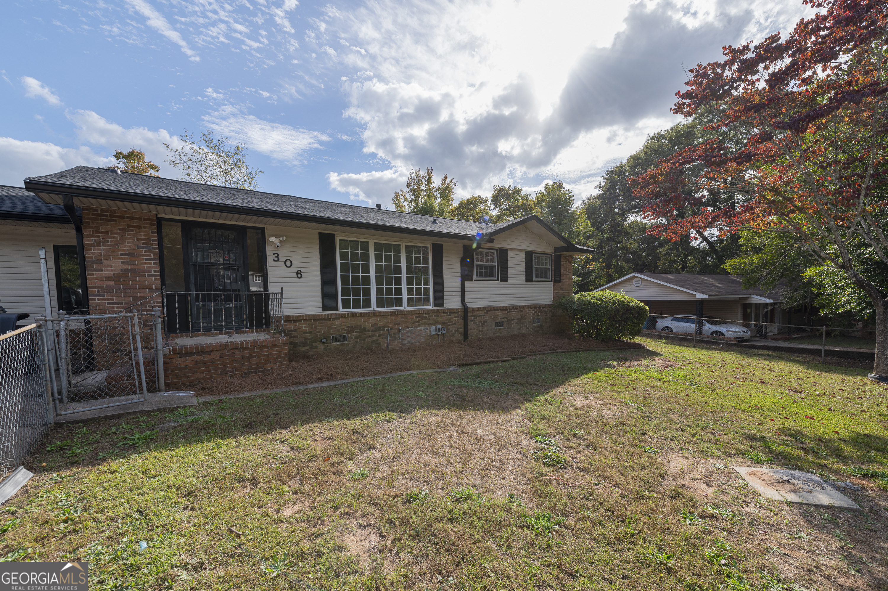 front view of a house with a yard