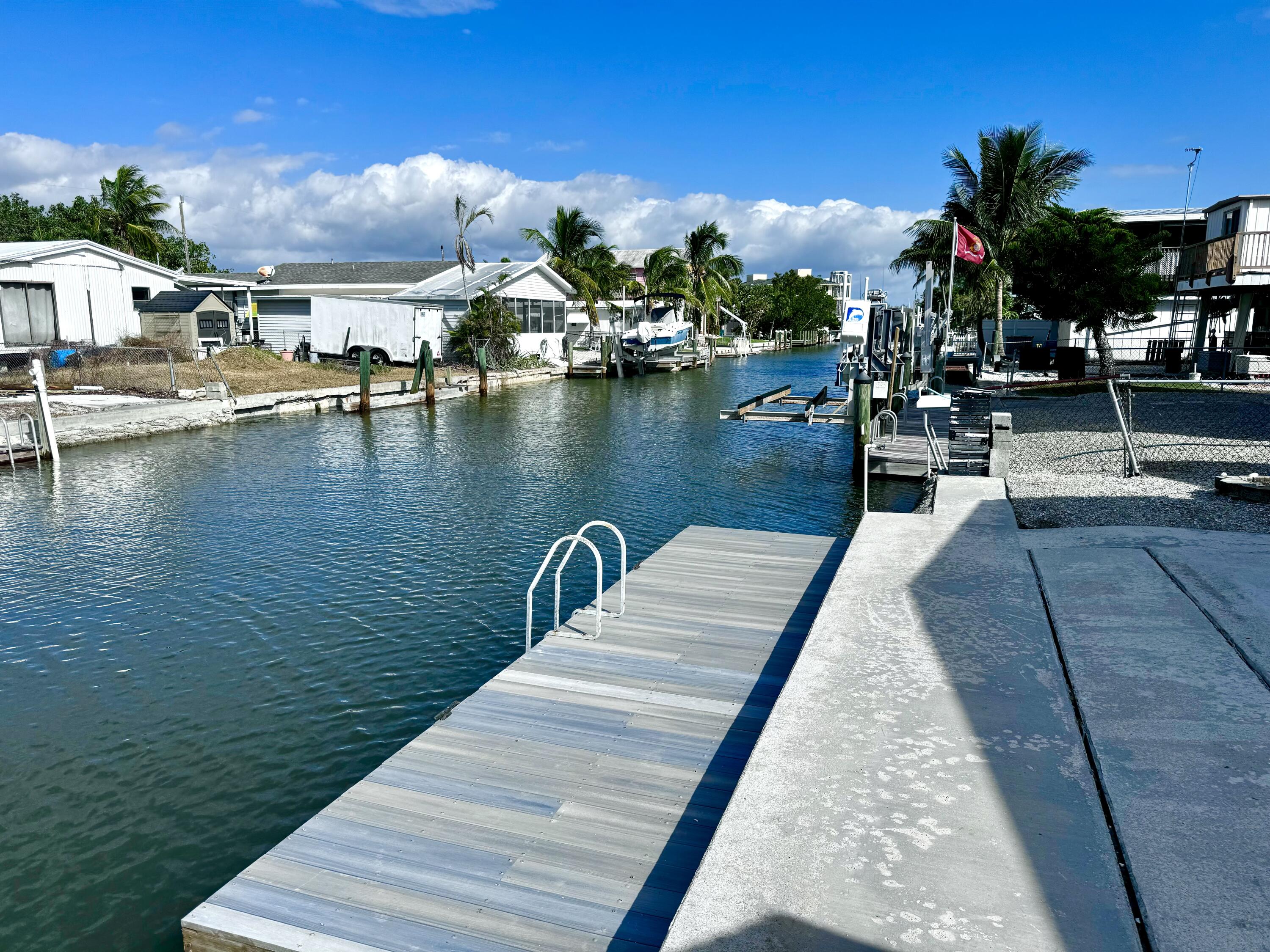 a view of a lake with outdoor seating