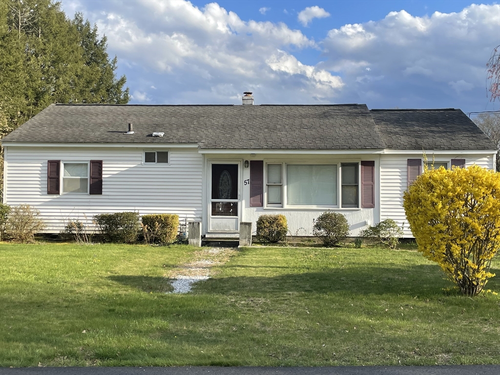 a view of a house with a backyard