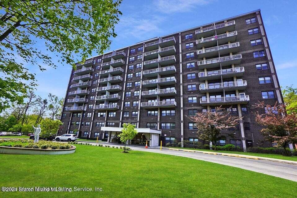 a large building with a yard in front of it