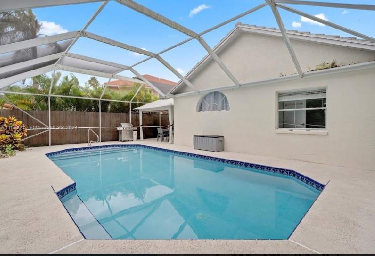 a view of a backyard with a swimming pool