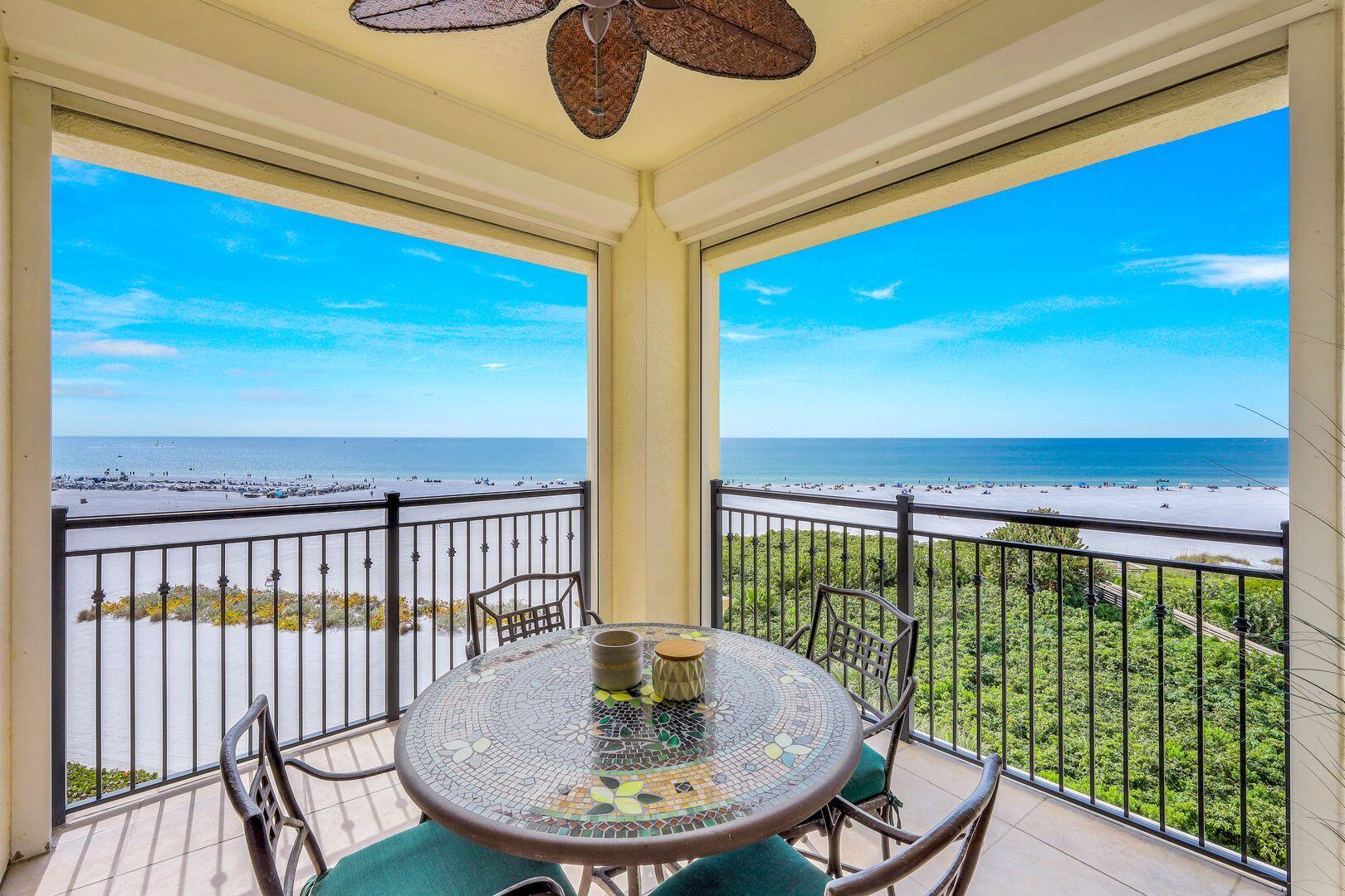 a view of a balcony with furniture