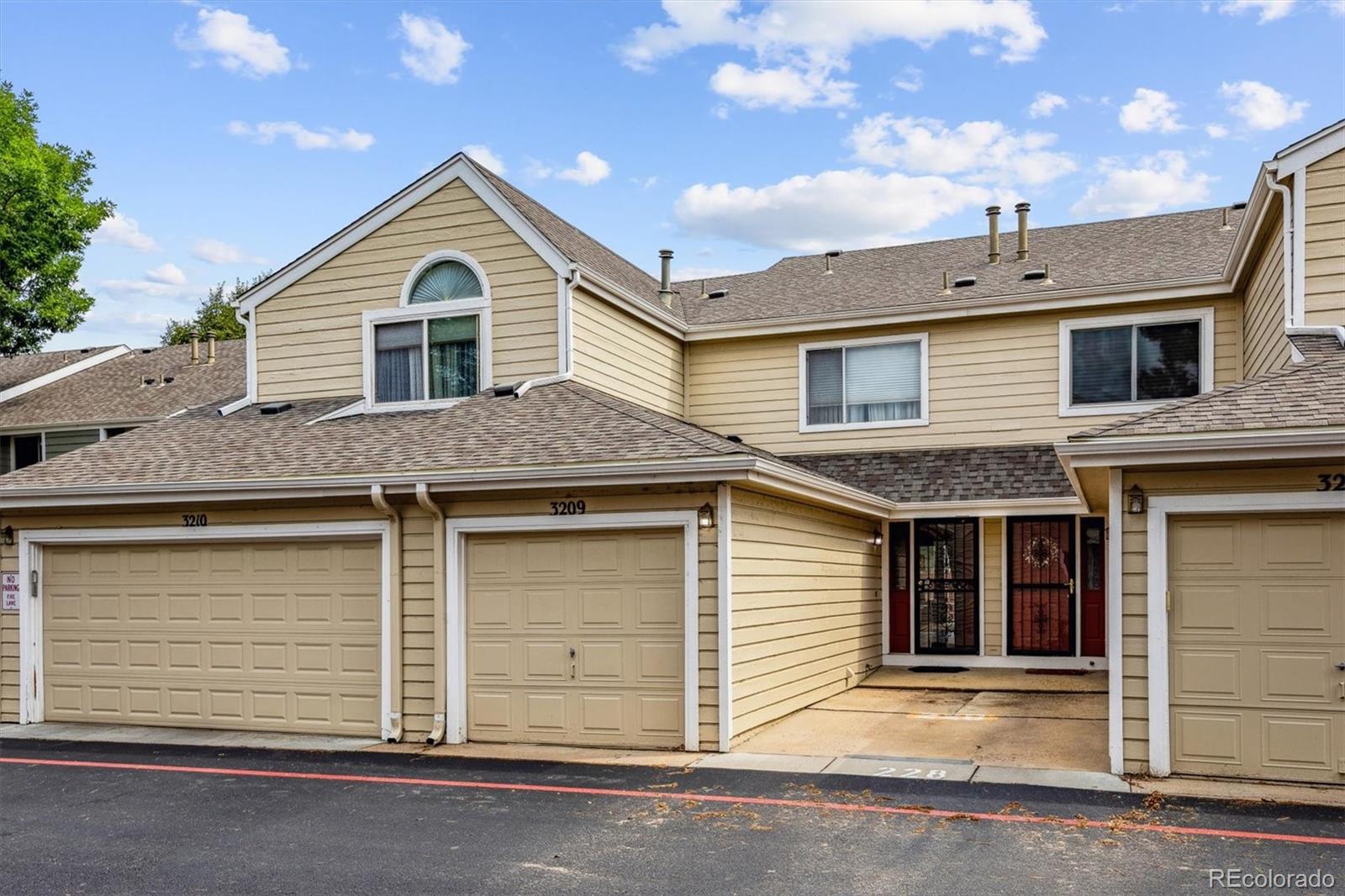 a front view of a house with a garage