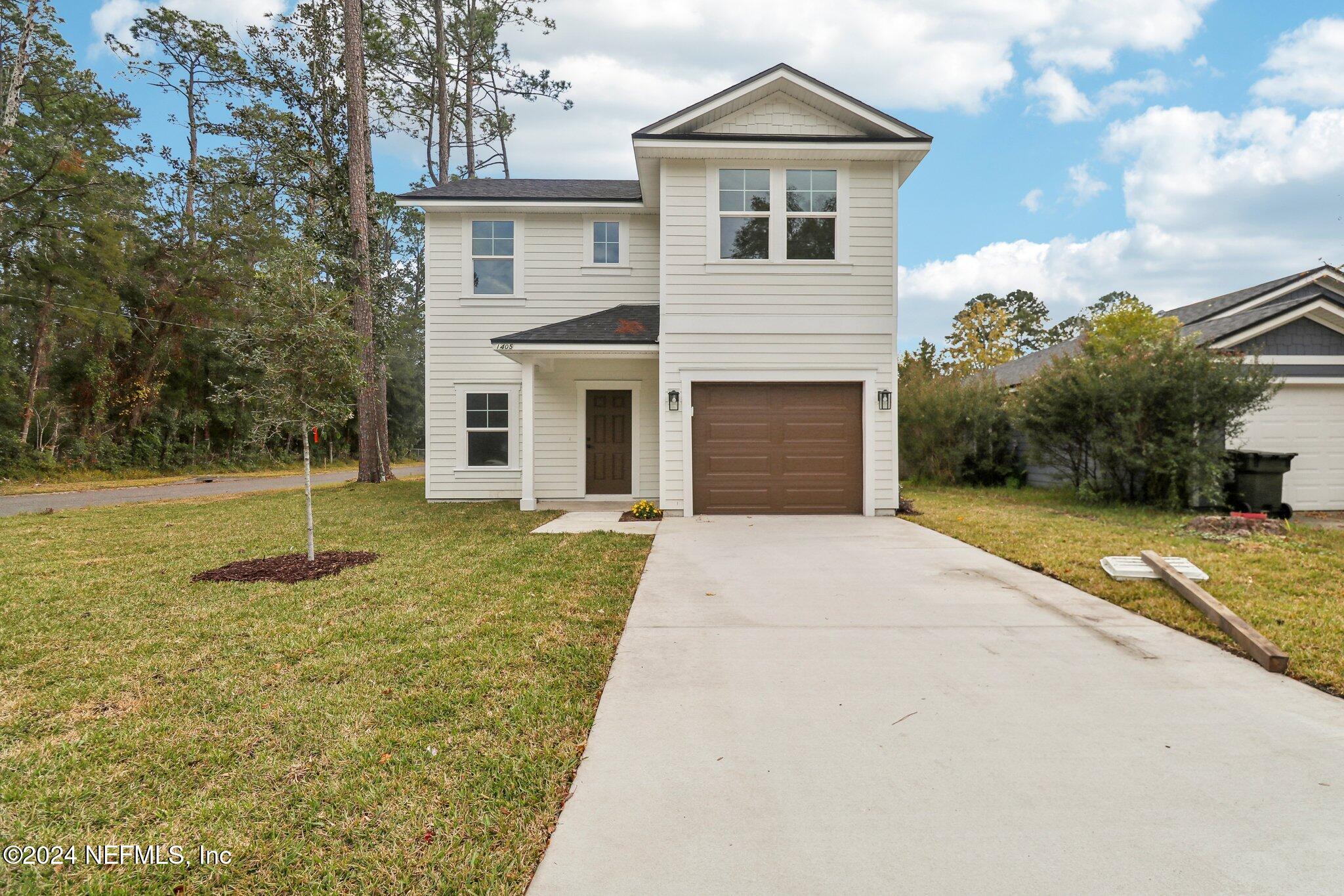 a front view of a house with a yard