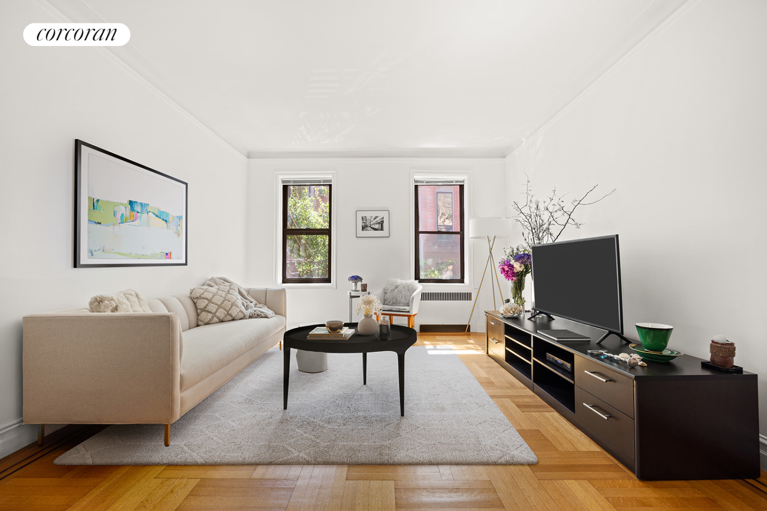 a living room with furniture and a flat screen tv