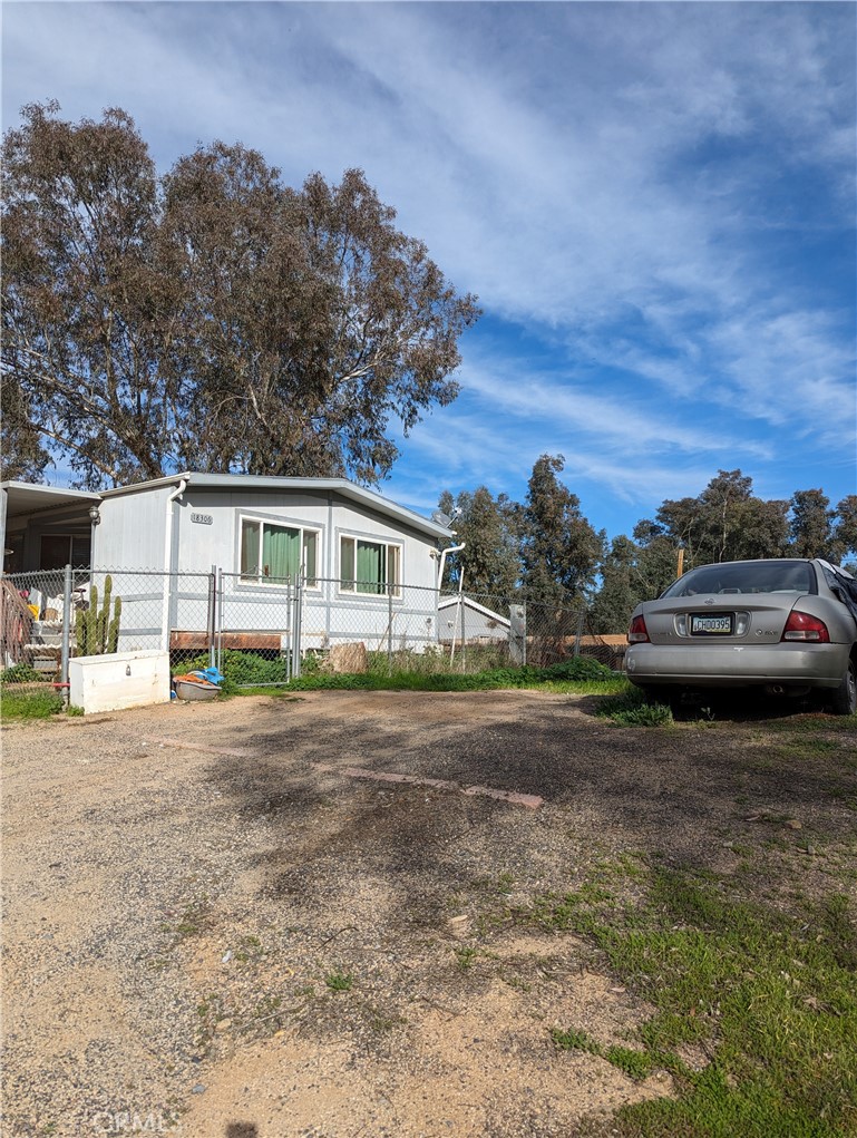 a view of a car parked in front of a house