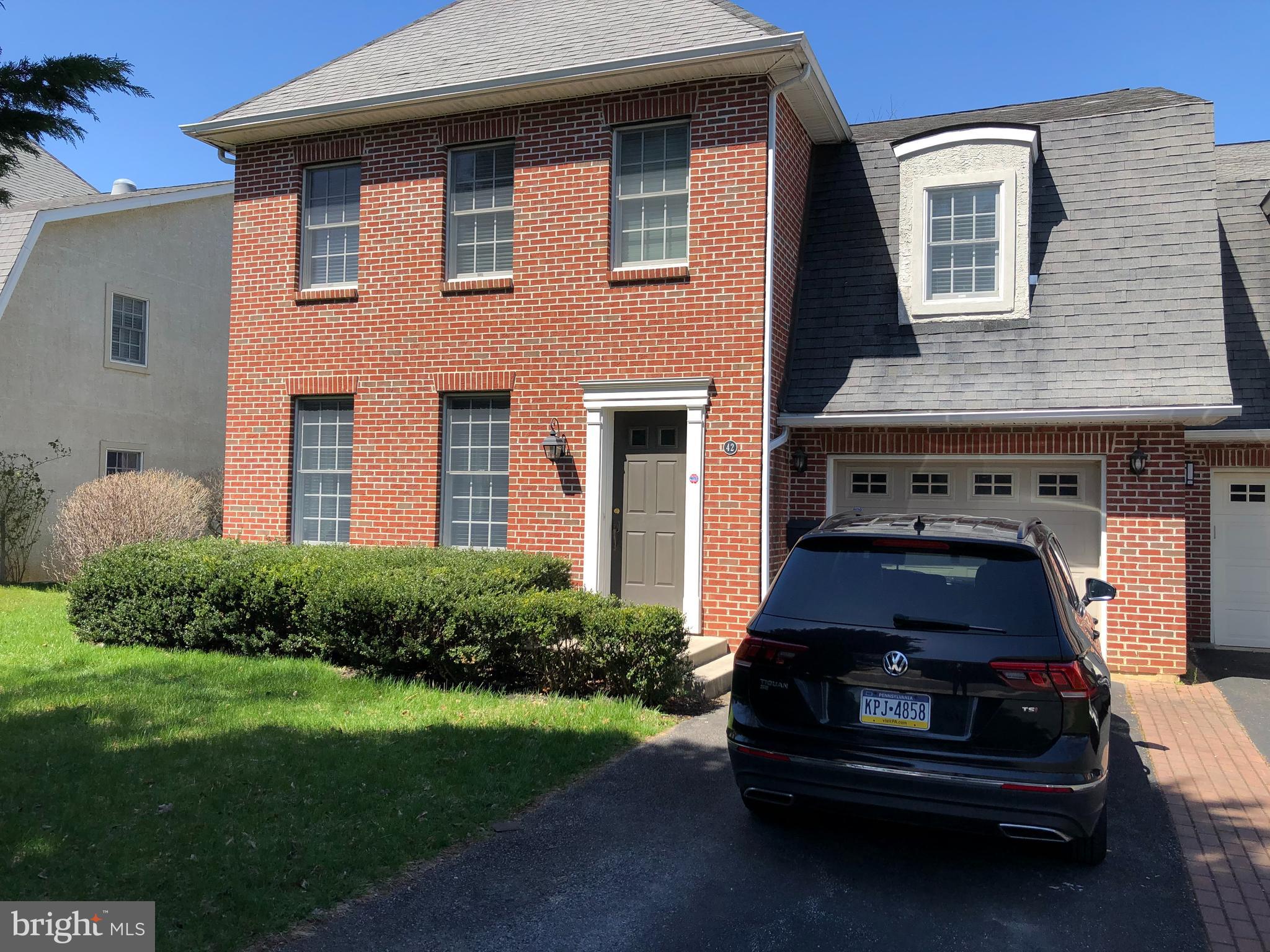 a car parked in front of a house