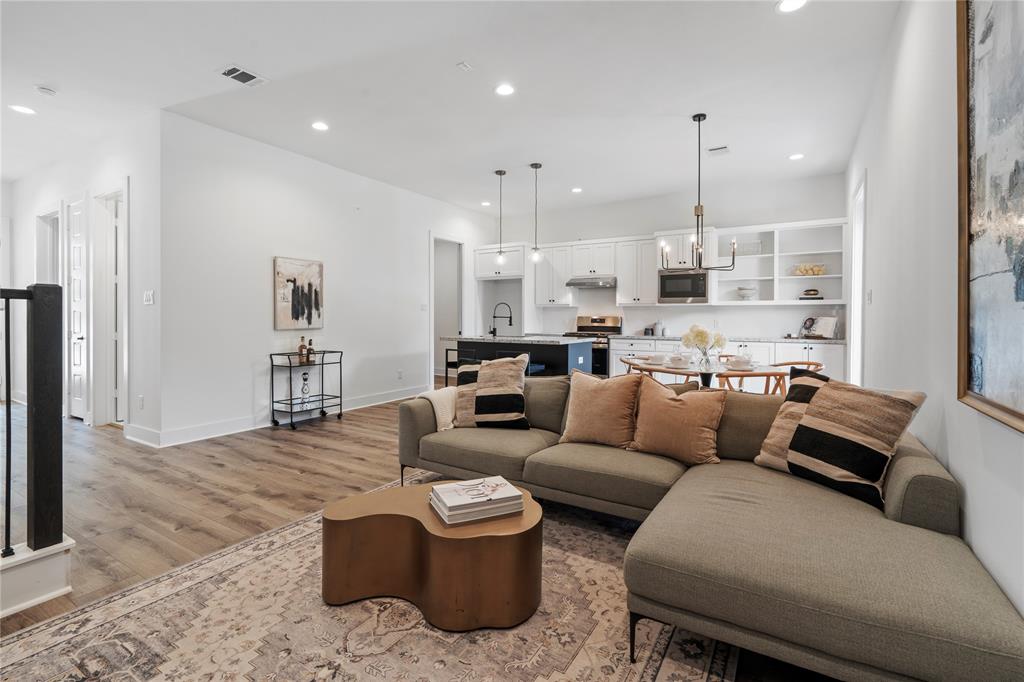The living area offers a perfect blend of comfort and style, with its open floor plan