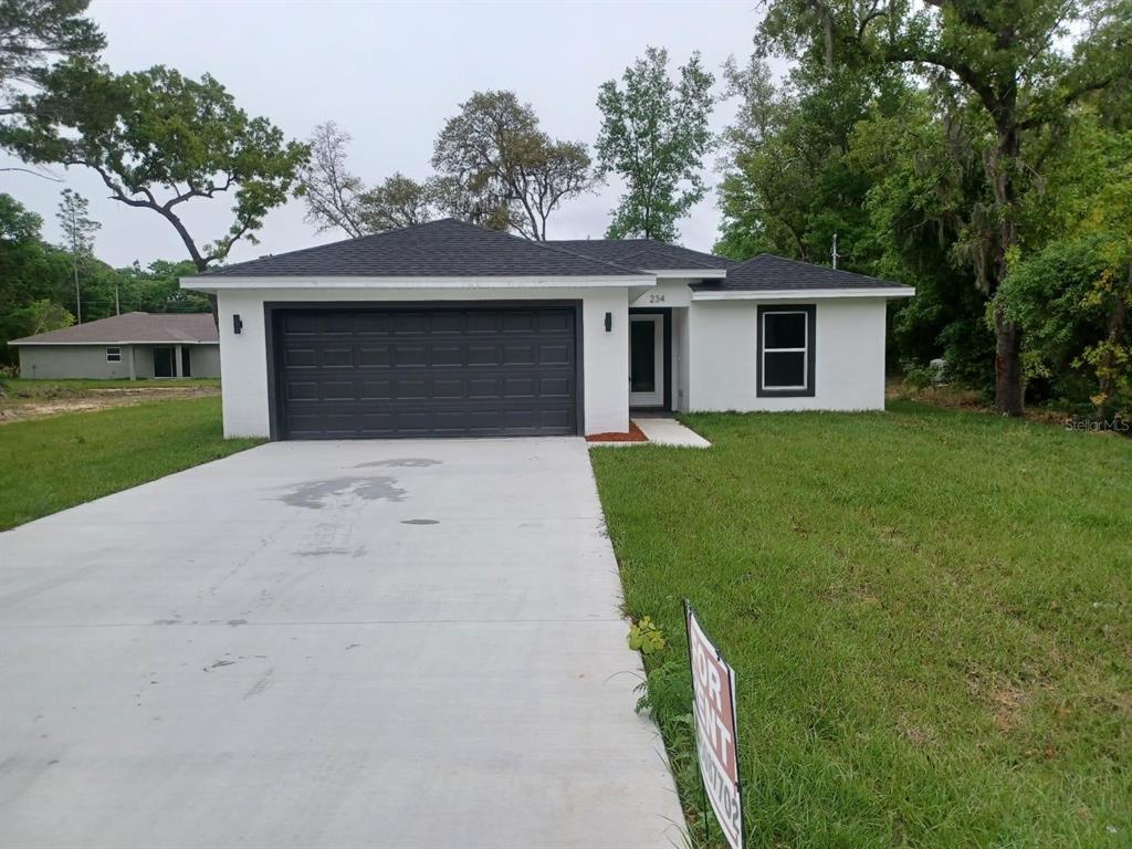 front view of a house with a yard