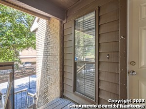 a view of wooden door and outdoor space