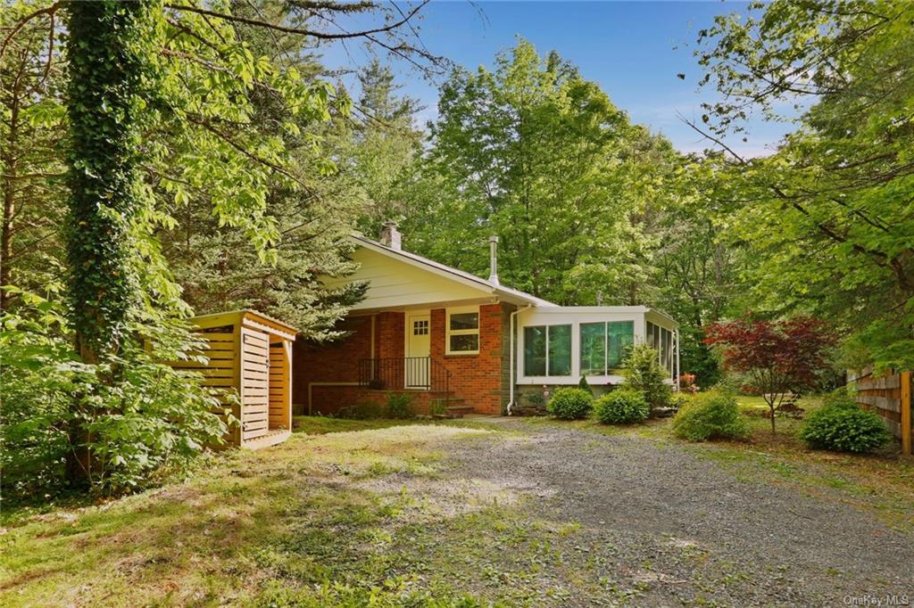 a view of a house with a tree