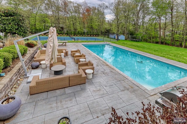 a view of a swimming pool with lounge chair