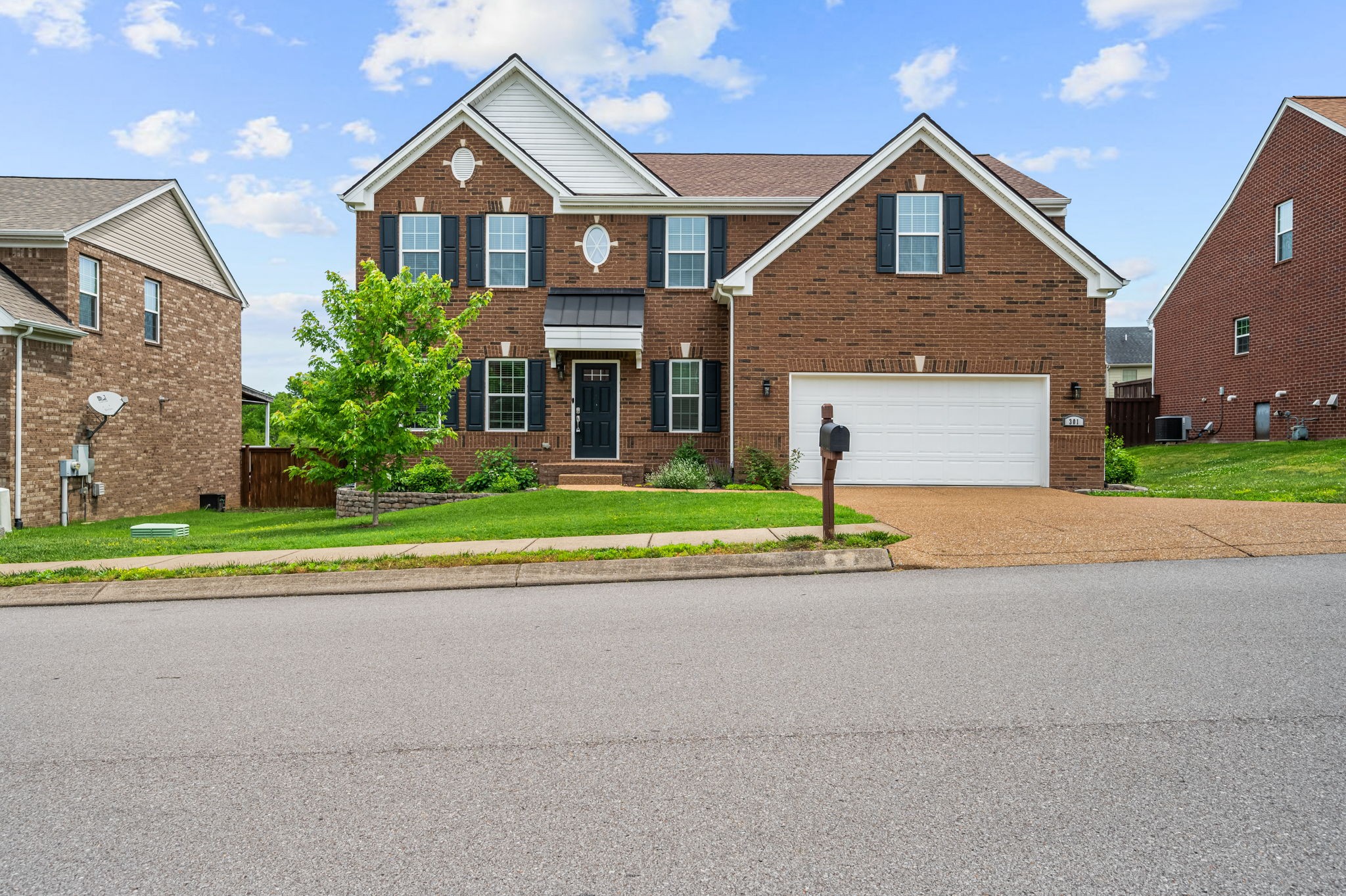 front view of a house and a yard