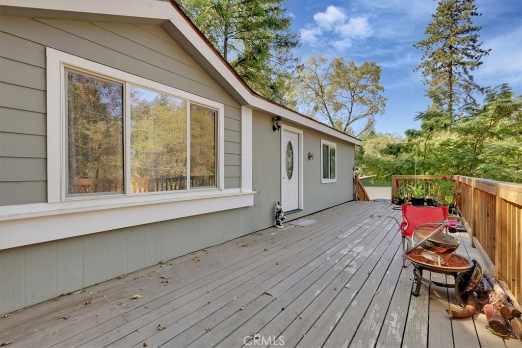 a view of a deck with wooden floor and seating space