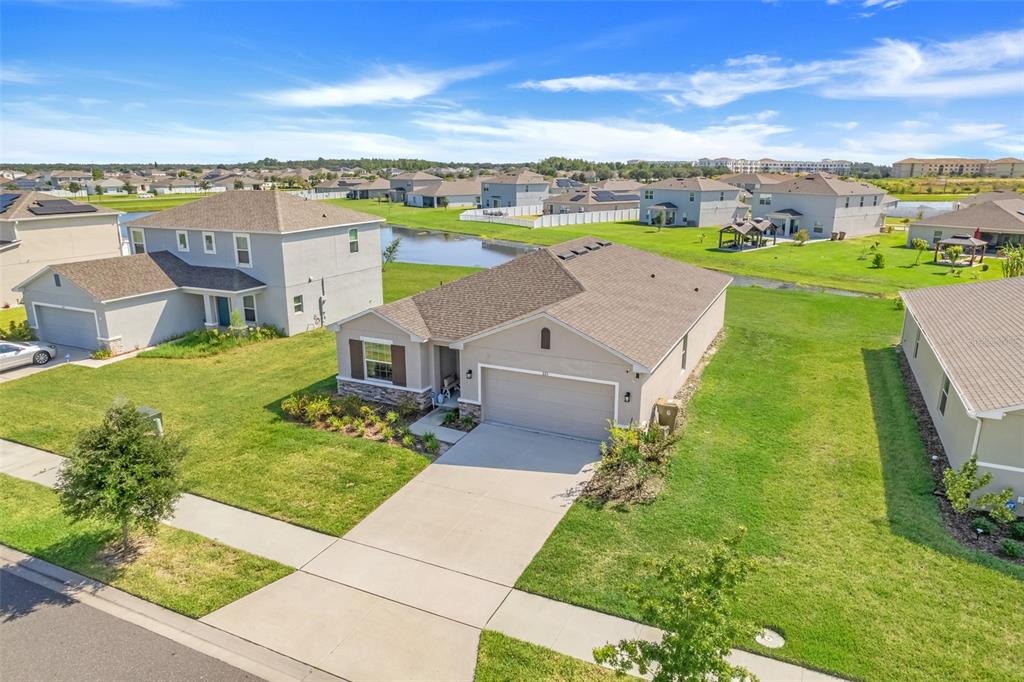 a aerial view of a house with big yard