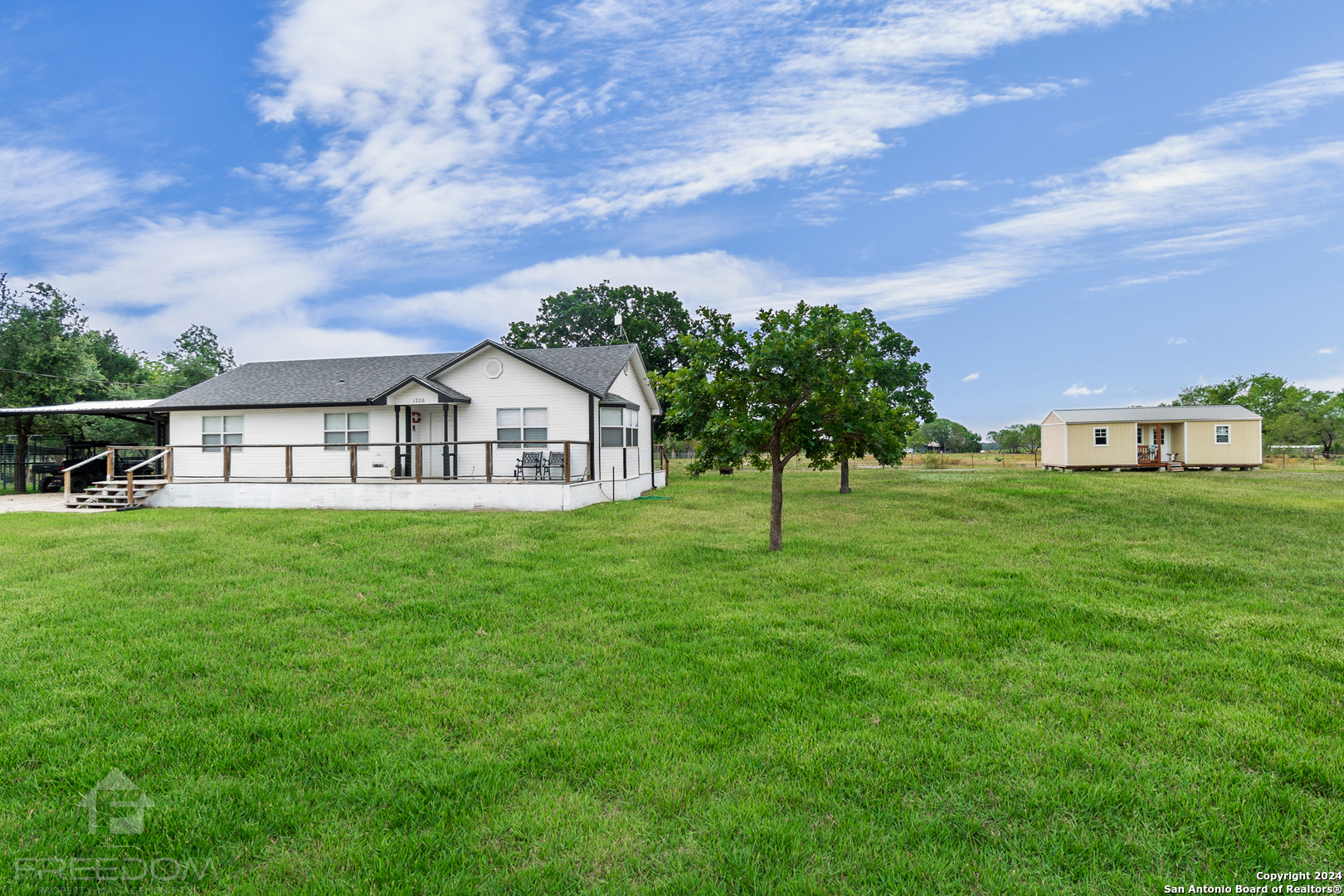 a view of a house with a yard