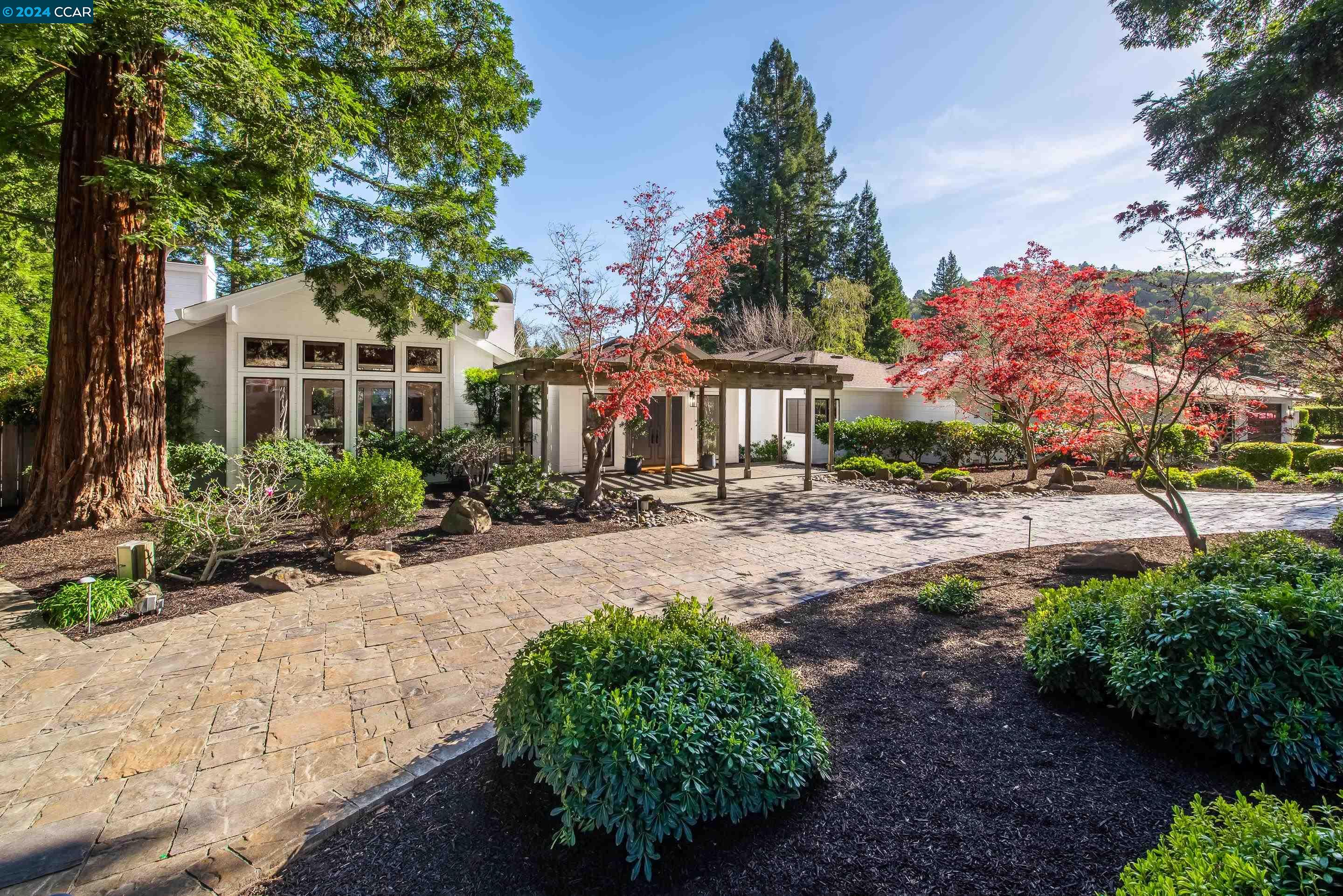 a front view of a house with garden