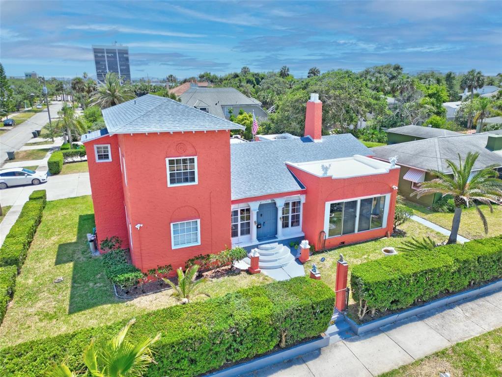 a aerial view of a house with yard