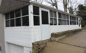 a view of a brick house with a large window