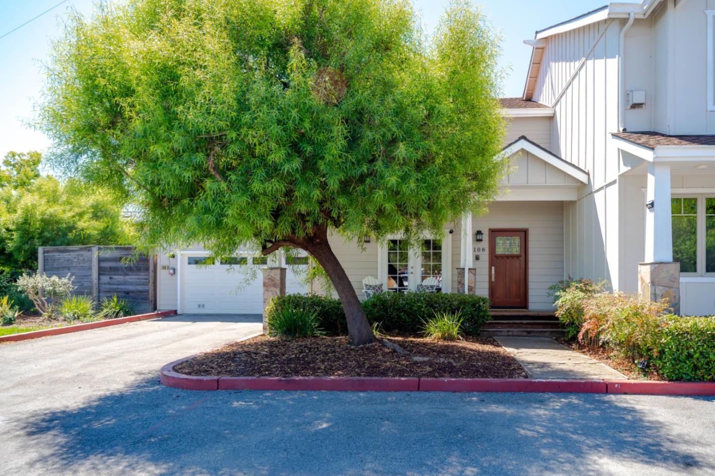 a front view of a house with garden