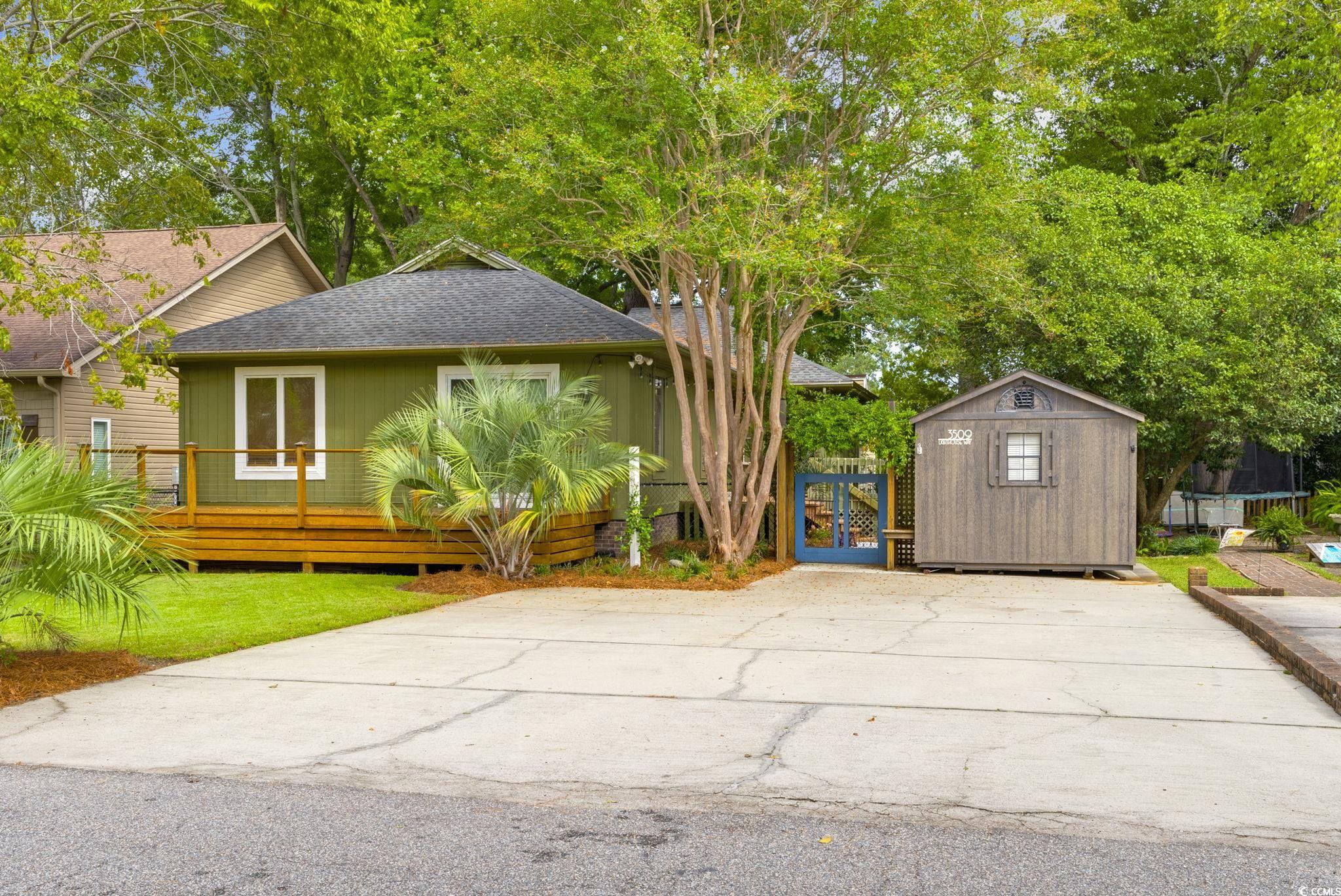 View of home's exterior featuring a storage shed