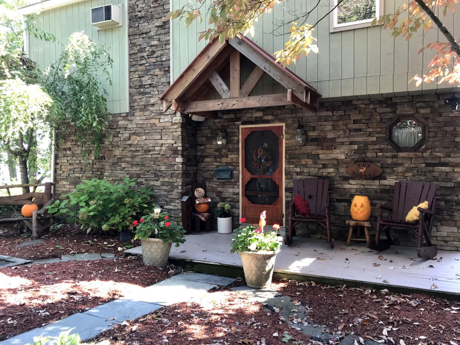 Doorway to property with a deck