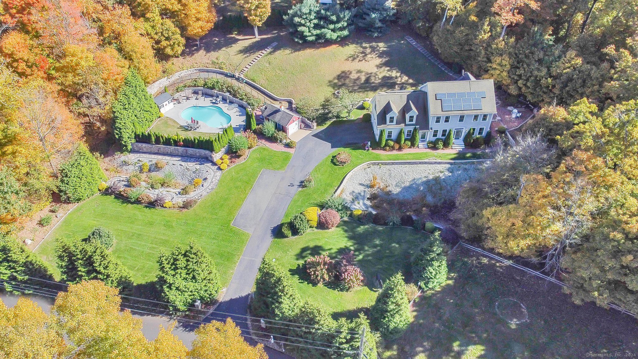 a view of a swimming pool with a yard