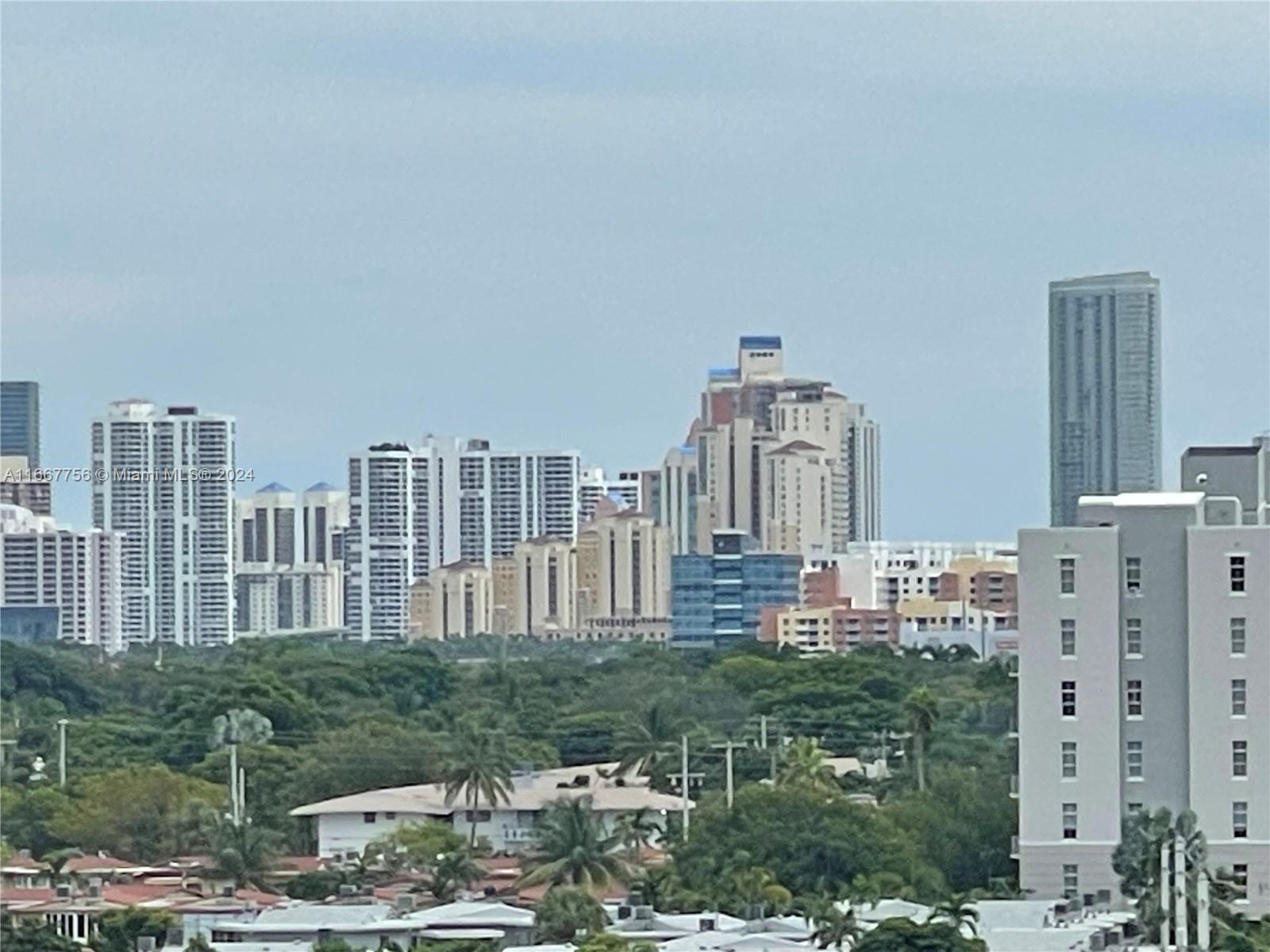 a view of city with tall buildings