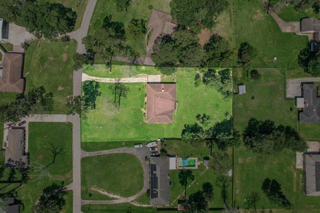 an aerial view of residential house with outdoor space and lake view