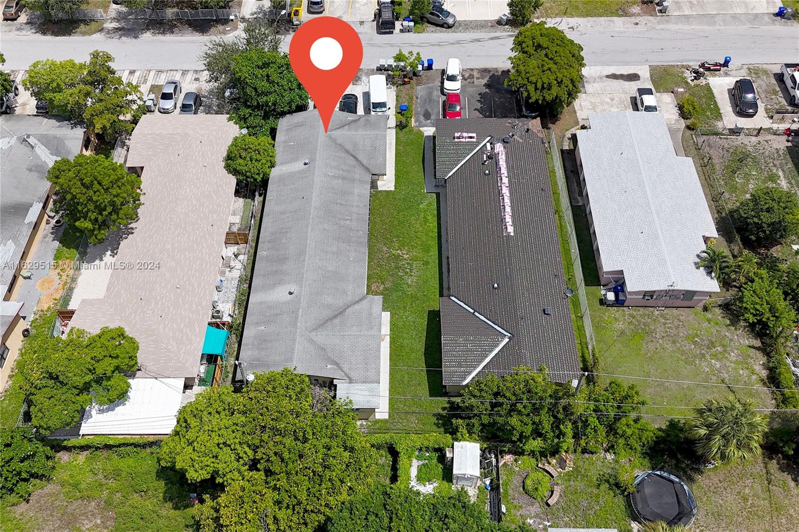 an aerial view of a house with a swimming pool