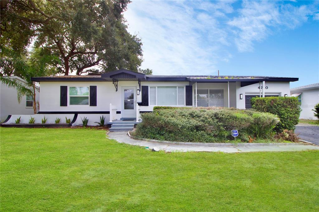 a house view with a garden space