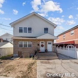 a front view of a house with garage