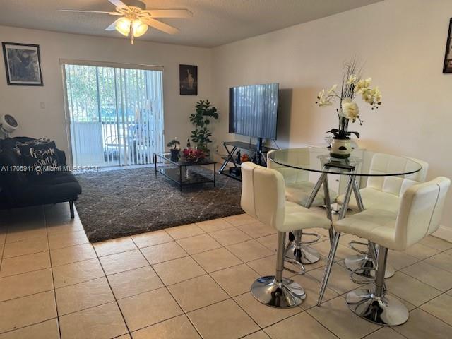 a living room with a table and chairs