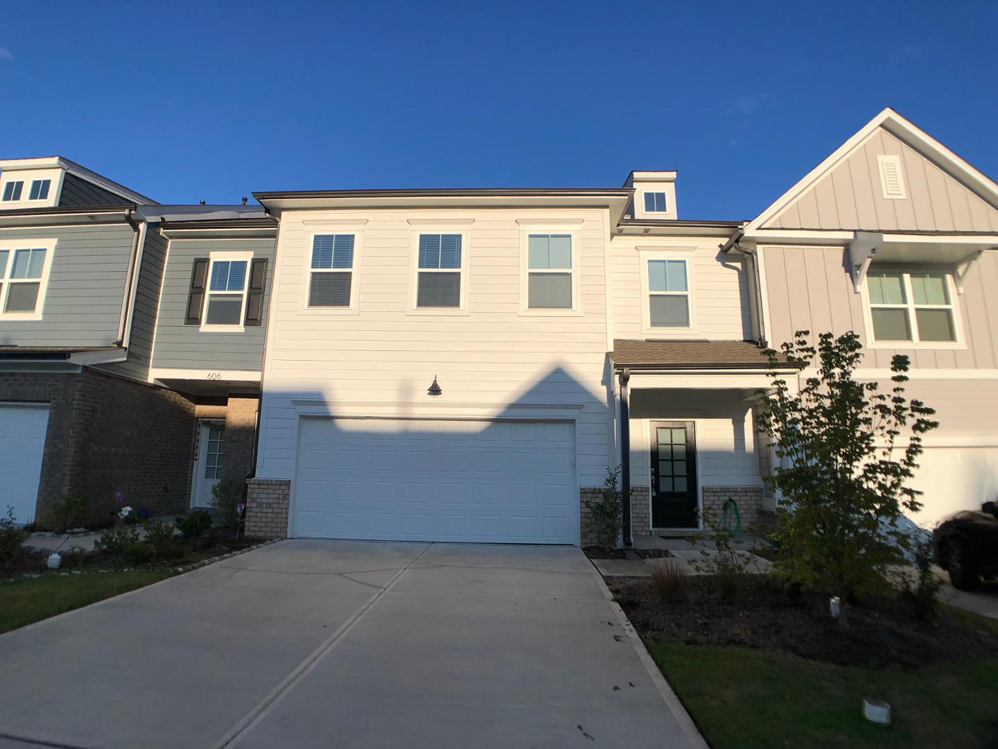 a front view of a house with yard