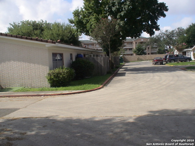 a view of street with parked cars