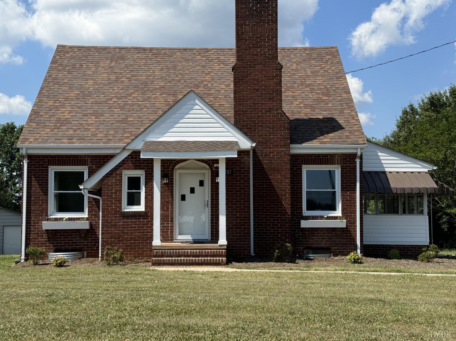 front view of a house with a yard