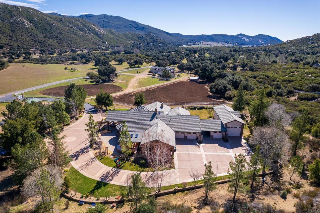 an aerial view of residential houses and outdoor space