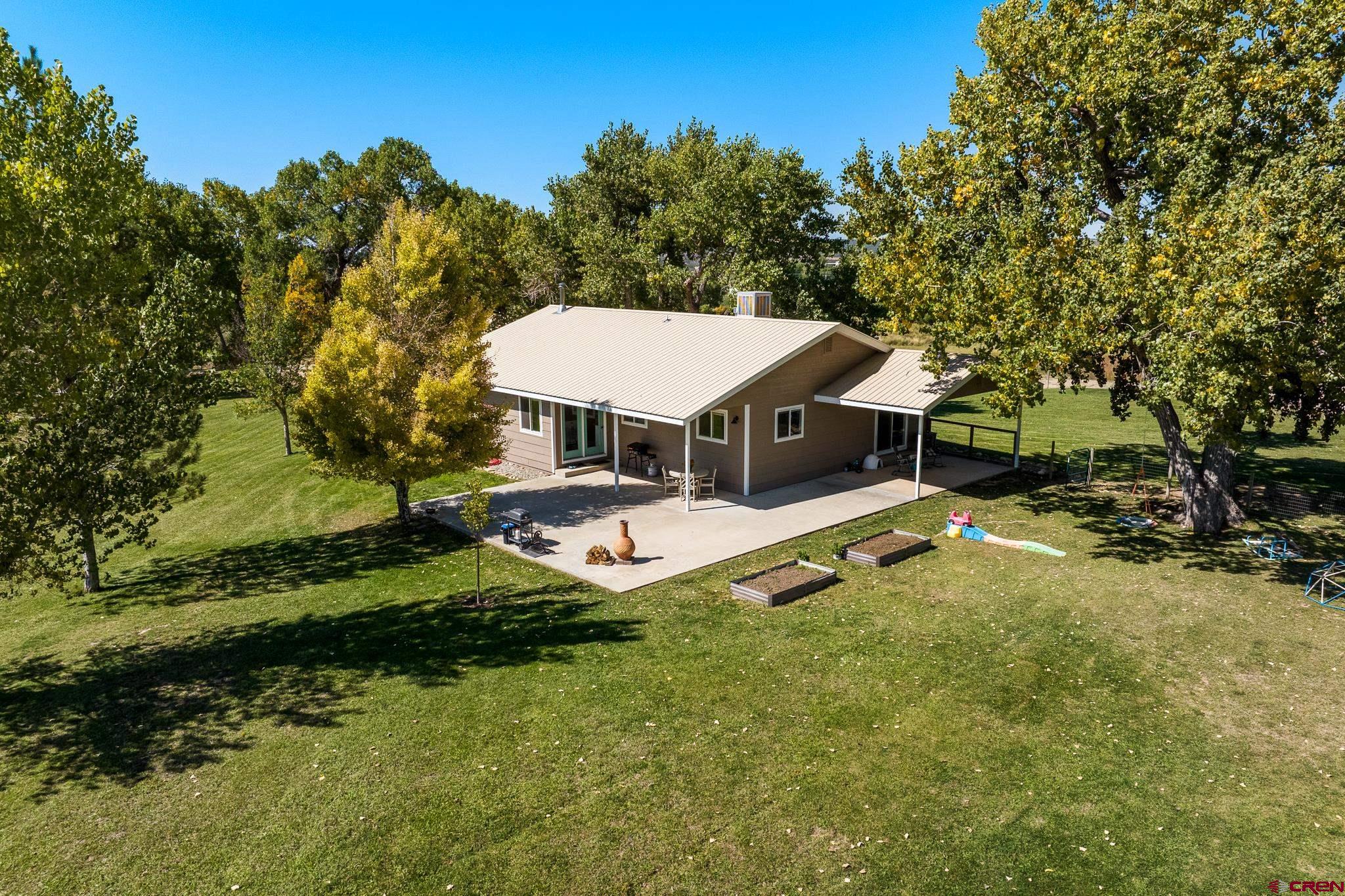 a view of a house with a big yard