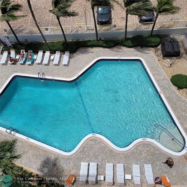 a view of swimming pool from a balcony