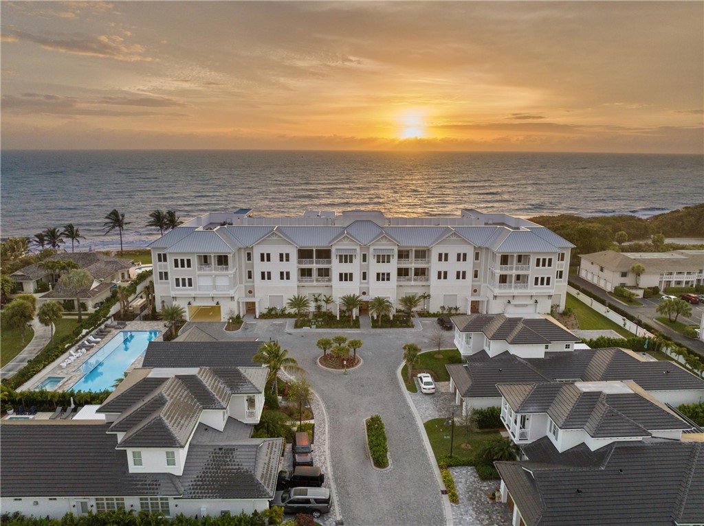 an aerial view of residential building with parking space